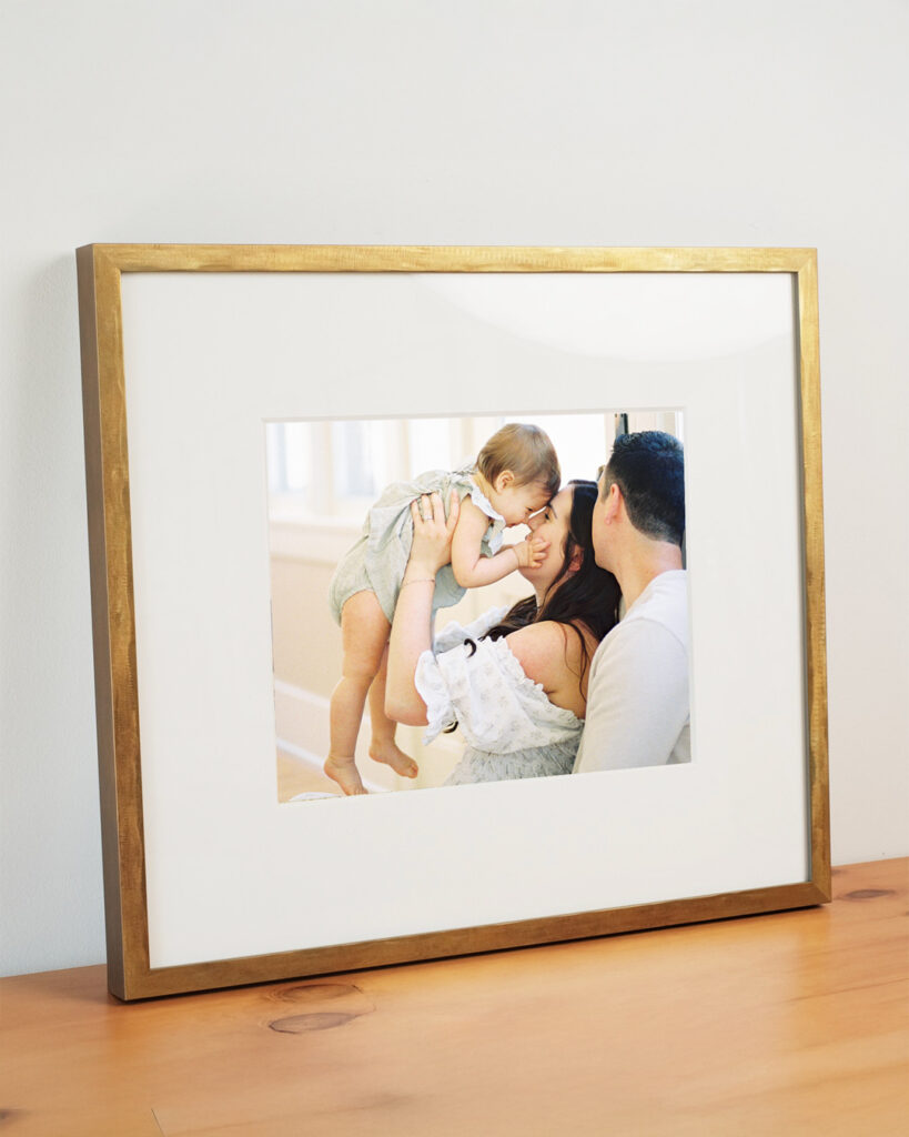 A custom framed print from an in home family session taken in Argyle, Texas.