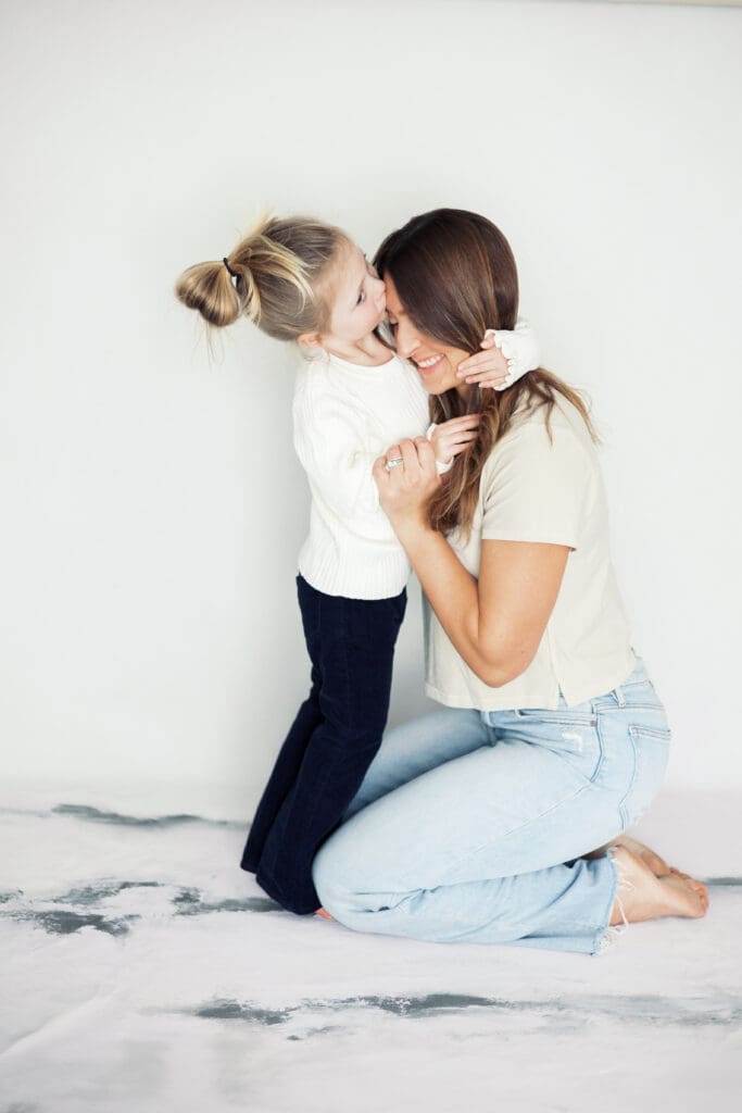 Photo of owner, Kayla, and her daughter at the Kayla Mari Photography studio.