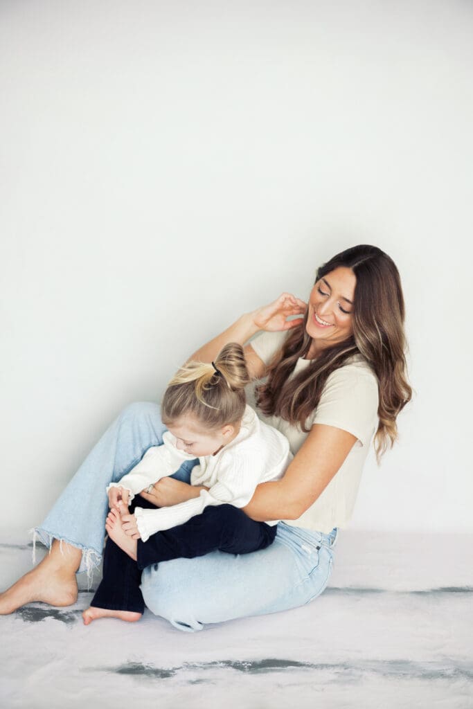 Photo of owner, Kayla, and her daughter at the Kayla Mari Photography studio.